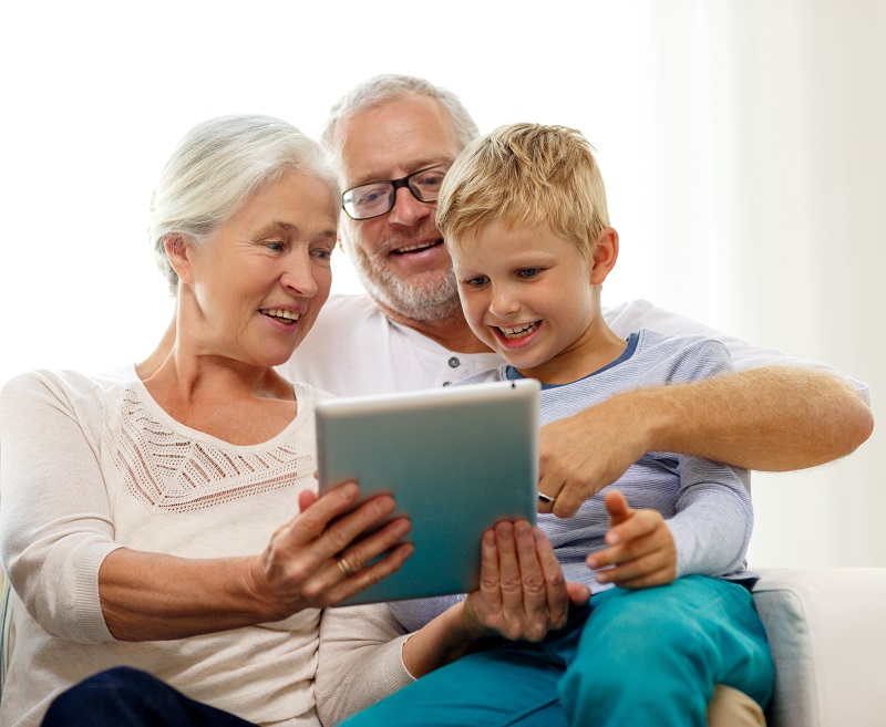 family, generation, technology and people concept - smiling family with tablet pc computers at home